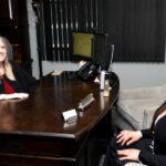 client meets with a lawyer