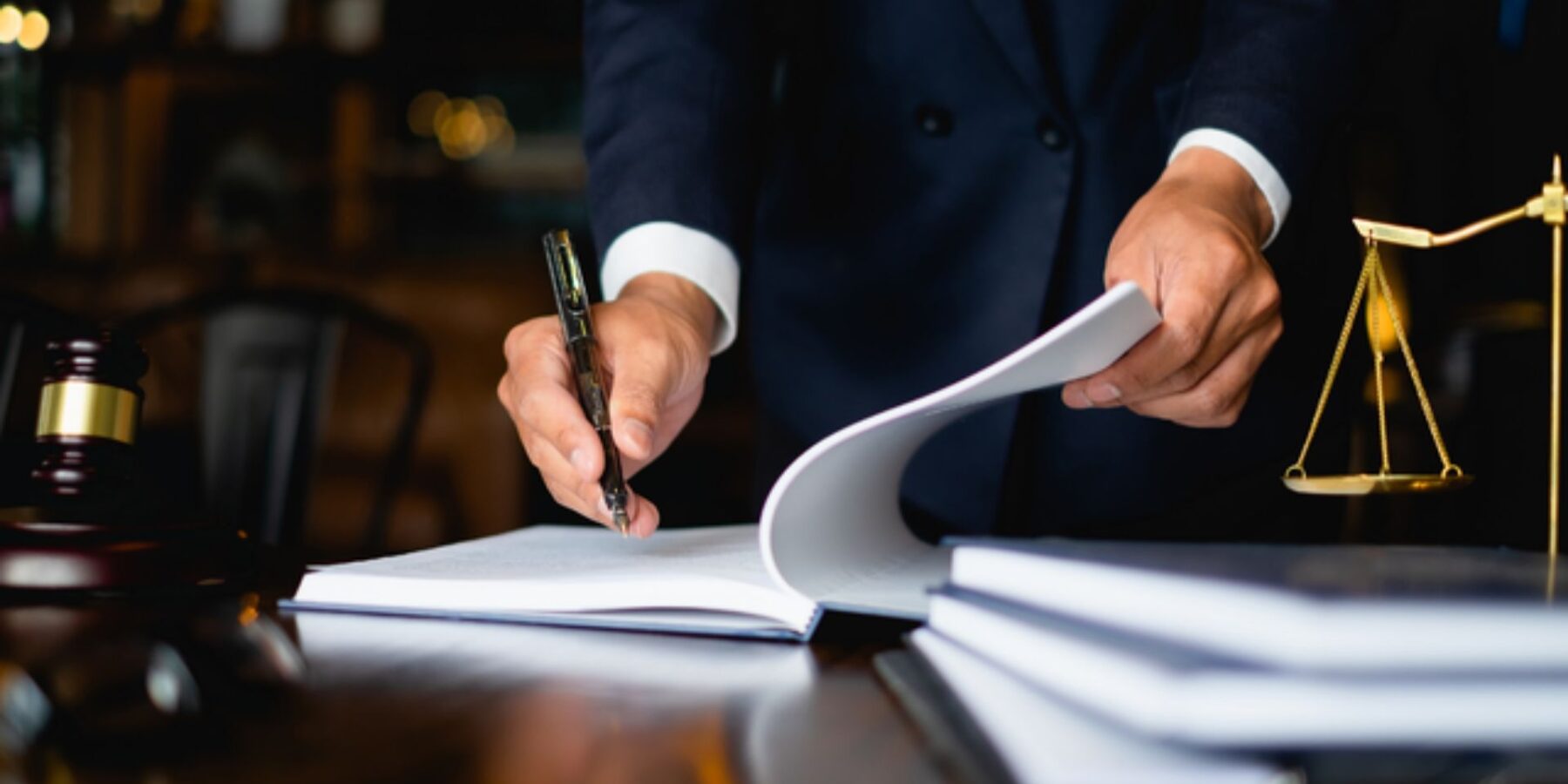 lawyer writing on a desk
