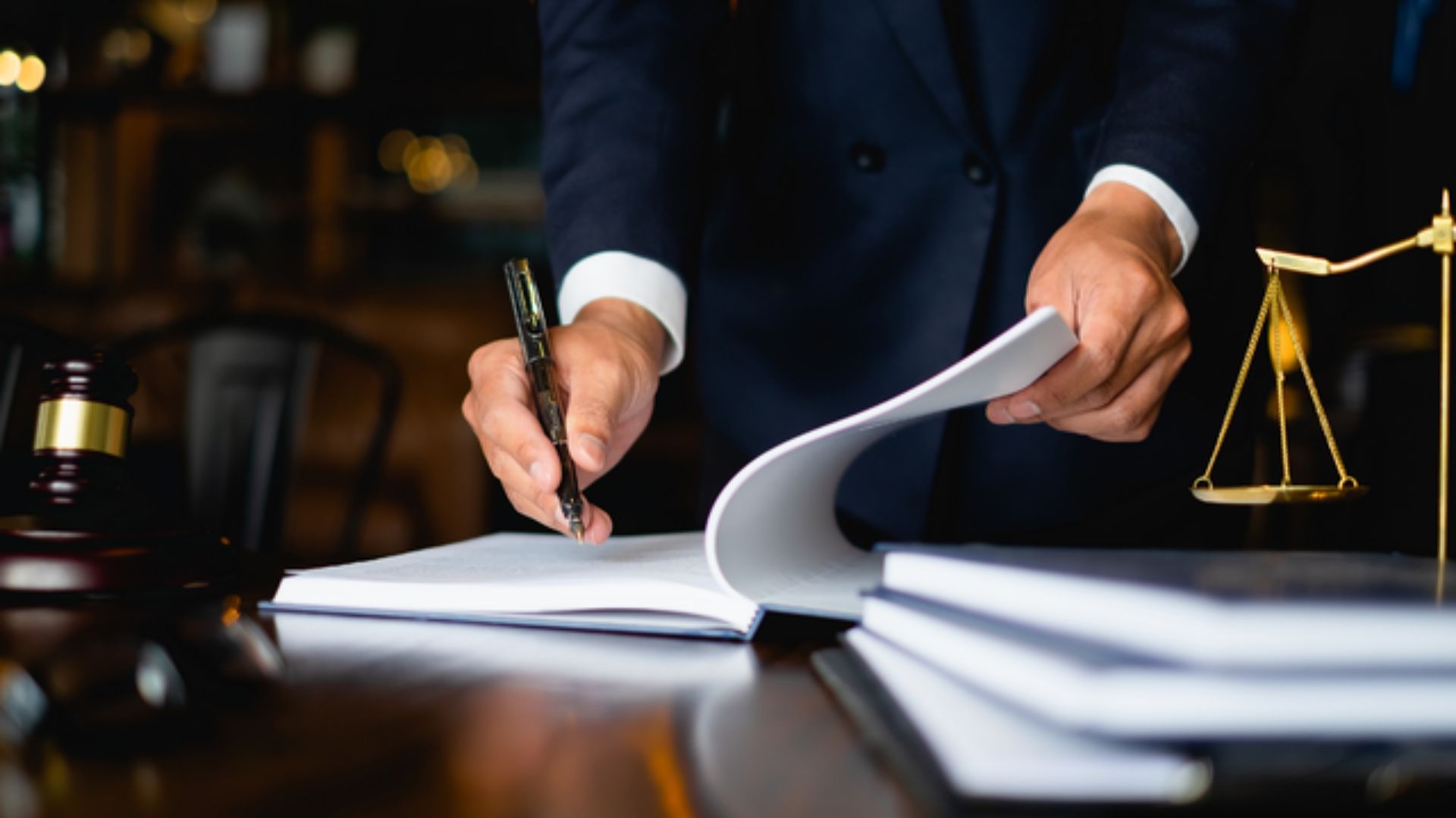 lawyer writing on a desk